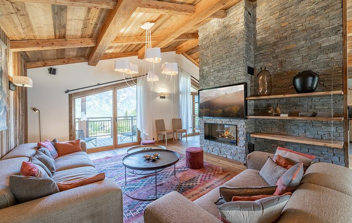 Spacious living room with stone fireplace