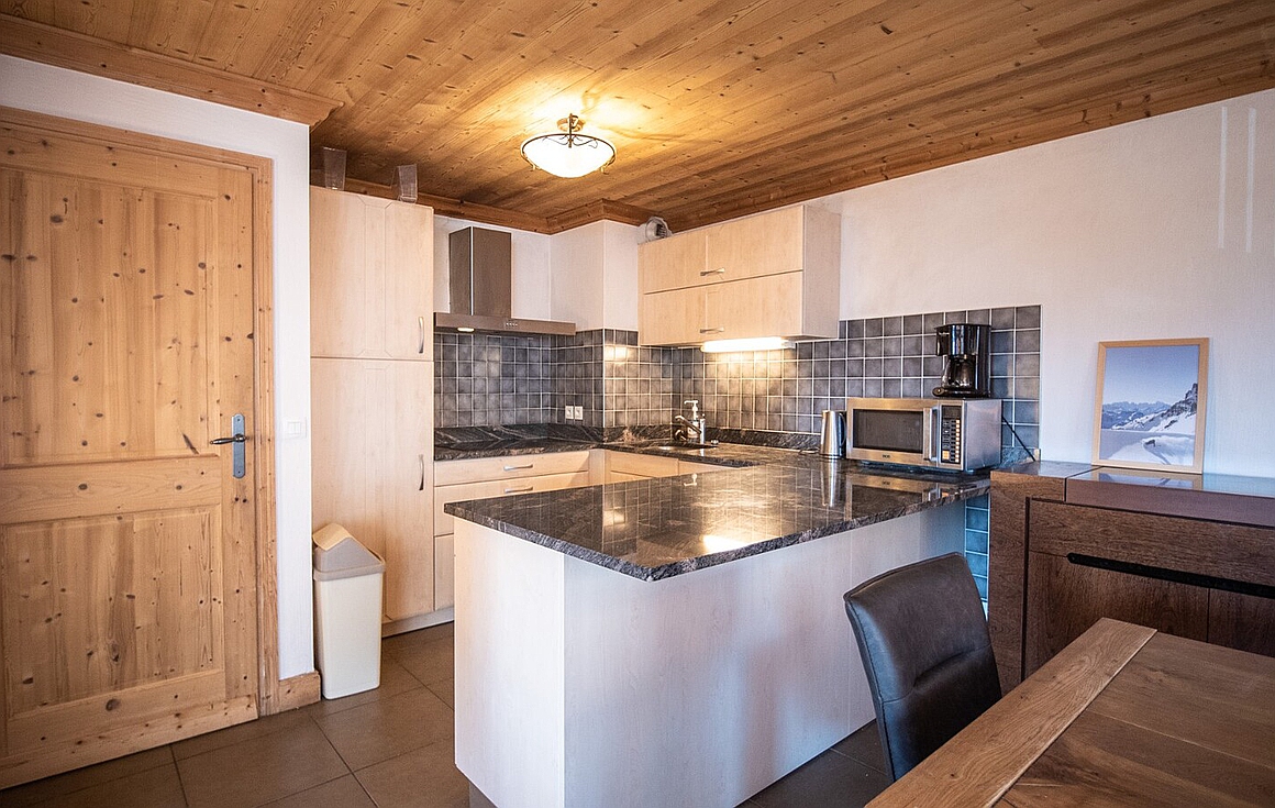 Compact kitchen with sleek countertops
