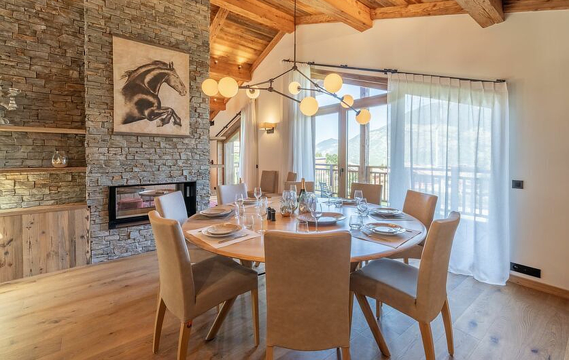 Sunlit dining space with mountain views
