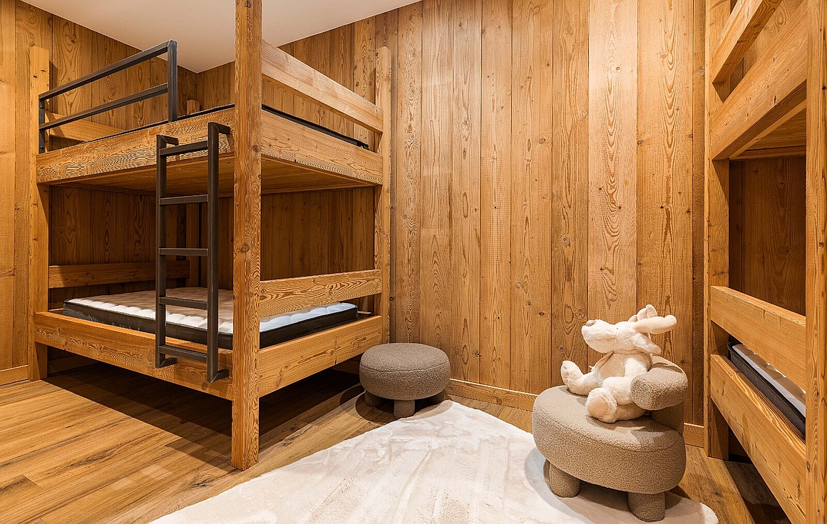 Charming bunk bedroom with wooden accents