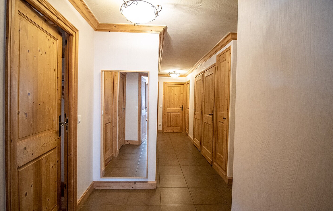 Bright corridor with wooden accents