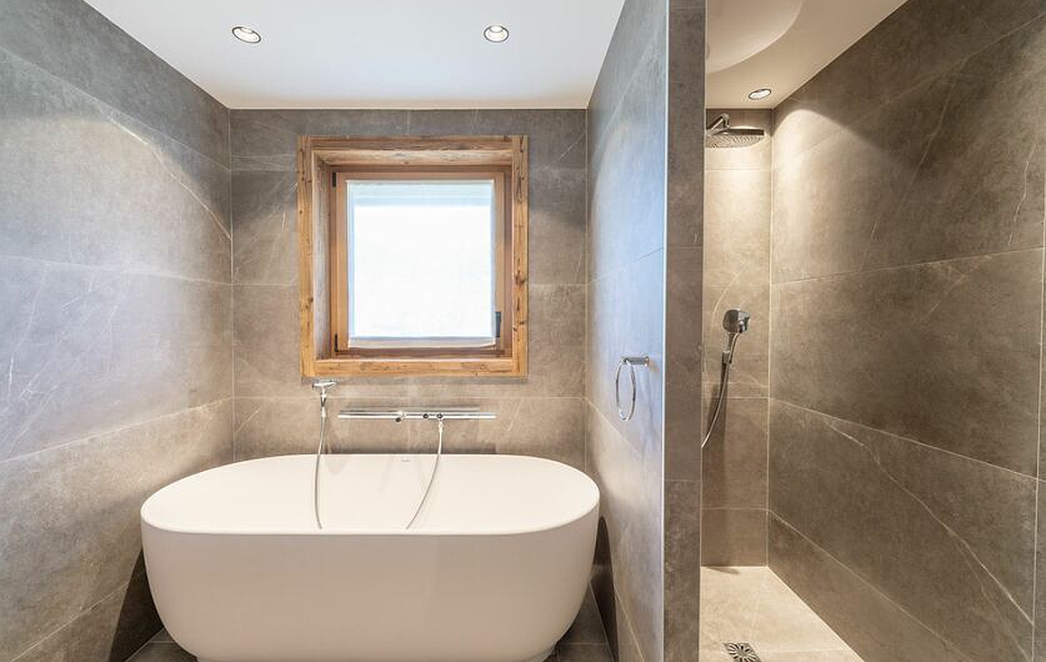 Modern bathroom with freestanding tub and rainfall shower